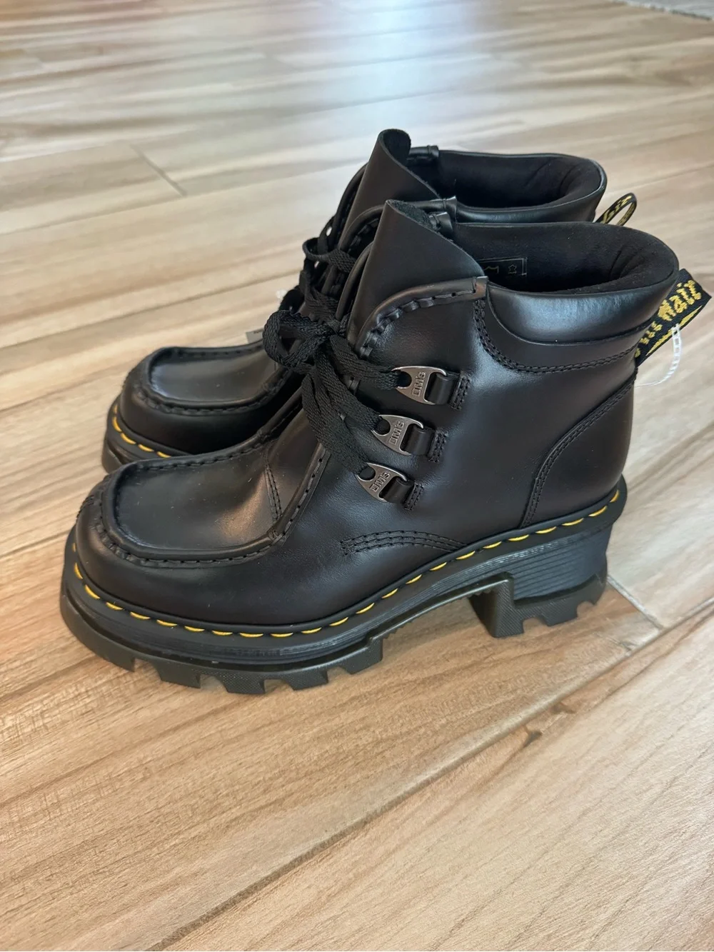 Dr. Martens Black Leather Lug-Sole Ankle Boots with Yellow Stitching